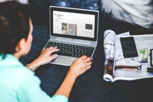 Woman navigating the Internet on her laptop